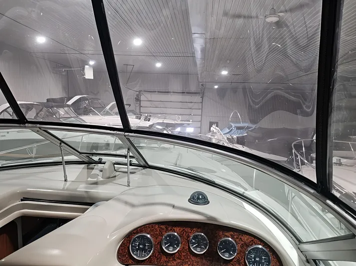  Yacht Photos Pics 2006 Sea Ray 340 Sundancer dashboard view in a boat storage facility.