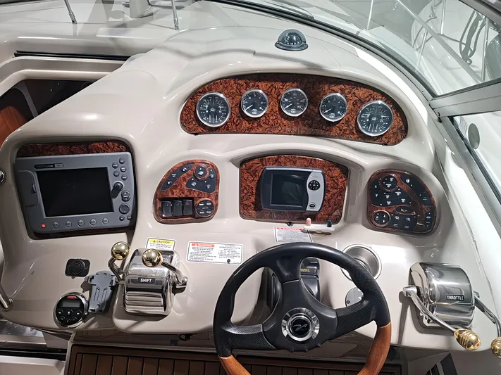  Yacht Photos Pics 2006 Sea Ray 340 Sundancer helm with gauges, controls, and navigation equipment.