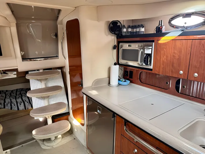  Yacht Photos Pics Interior of 2006 Sea Ray 340 Sundancer yacht with kitchenette and stairs.