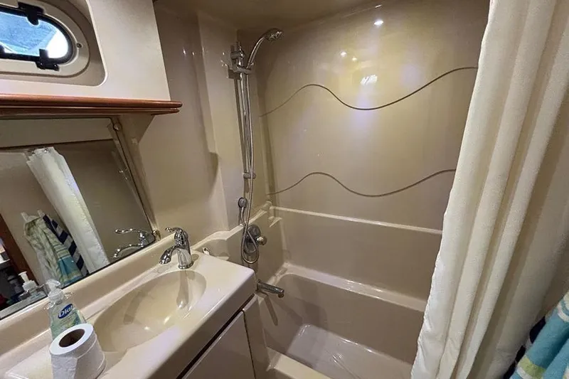  Yacht Photos Pics Bathroom interior of 2003 Cruisers Yachts 3750 Motoryacht with shower and sink.