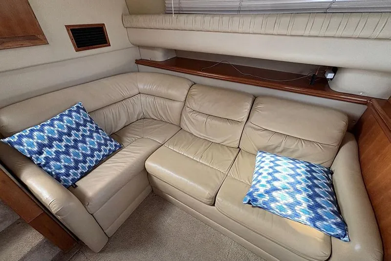  Yacht Photos Pics Luxurious beige leather sofa with blue patterned cushions in 2003 Cruisers Yachts 3750 Motoryacht.