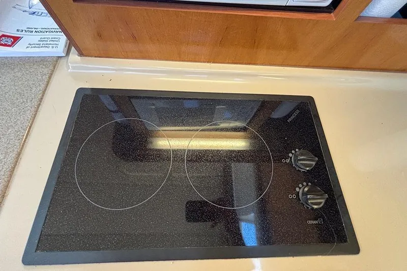  Yacht Photos Pics Glass cooktop in 2003 Cruisers Yachts 3750 Motoryacht kitchen area.