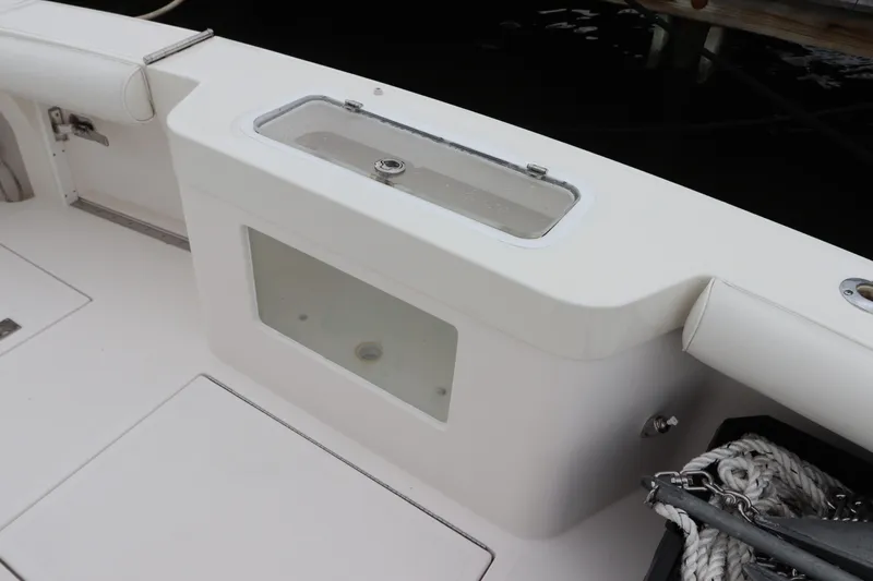  Yacht Photos Pics 2007 Cabo 40 Hardtop Express boat deck with storage compartment and ropes.