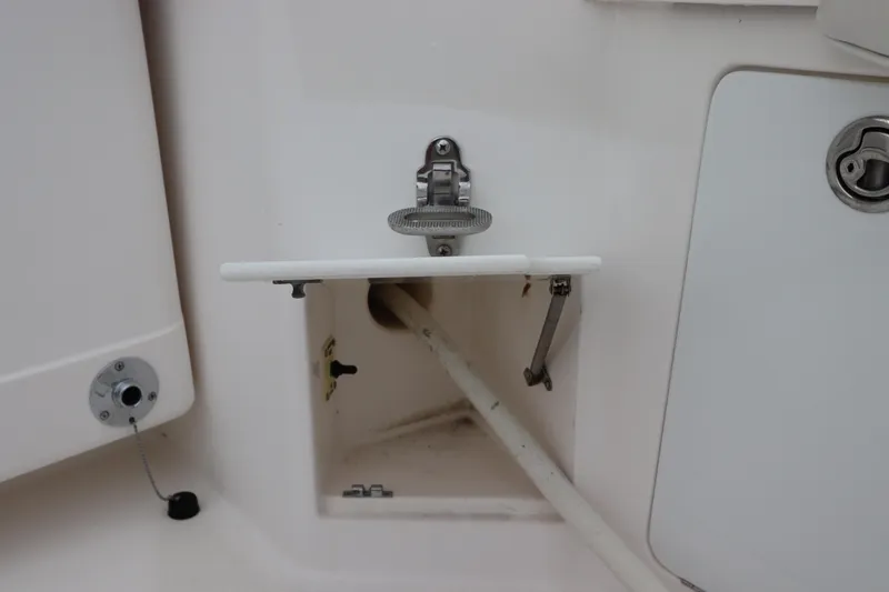  Yacht Photos Pics 2007 Cabo 40 Hardtop Express boat compartment with open hatch and visible pipe.