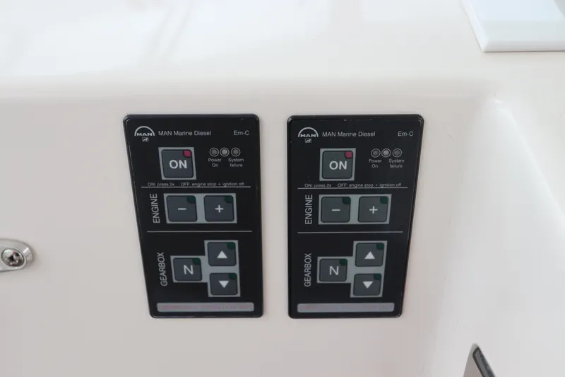  Yacht Photos Pics Control panel of 2007 Cabo 40 Hardtop Express with MAN Marine Diesel engine controls.