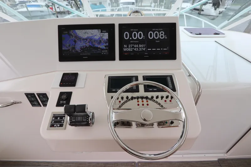  Yacht Photos Pics Helm of 2007 Cabo 40 Hardtop Express with navigation screens and controls.