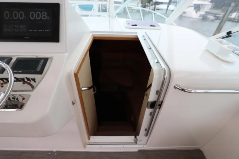  Yacht Photos Pics 2007 Cabo 40 Hardtop Express cabin entrance with control panel and steering wheel visible.