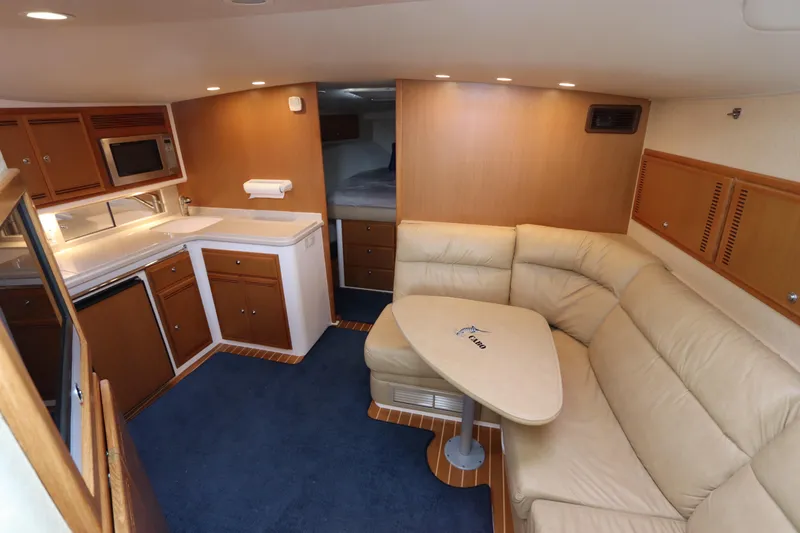  Yacht Photos Pics Interior of 2007 Cabo 40 Hardtop Express yacht with kitchen and seating area.