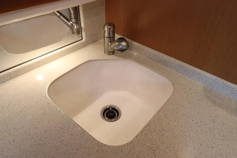  Yacht Photos Pics White sink with modern faucet on speckled countertop, Cabo 40 Hardtop Express 2007.