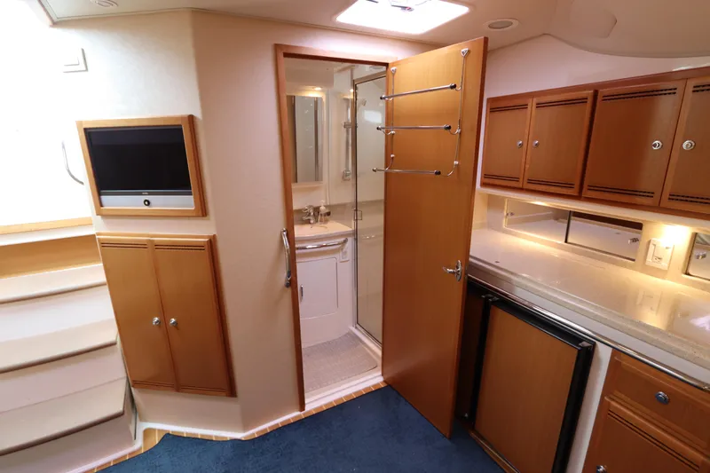  Yacht Photos Pics 2007 Cabo 40 Hardtop Express interior with kitchenette, cabinets, and bathroom.