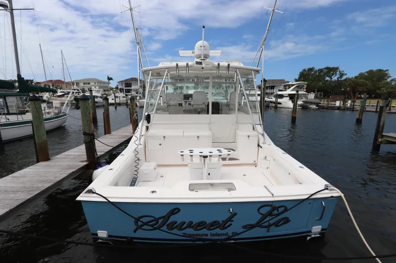  Yacht Photos Pics 2007 Cabo 40 Hardtop Express boat docked at marina, rear view.