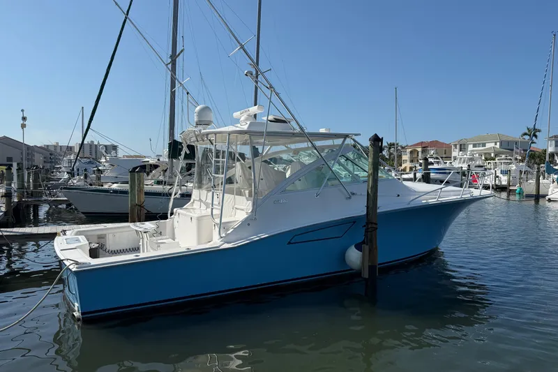  Yacht Photos Pics 2007 Cabo 40 Hardtop Express boat docked in marina under clear blue sky.