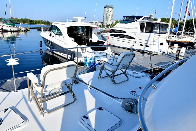 Two Buoys Yacht Photos Pics 2002 PDQ 32 Power Catamaran docked in marina with other boats.
