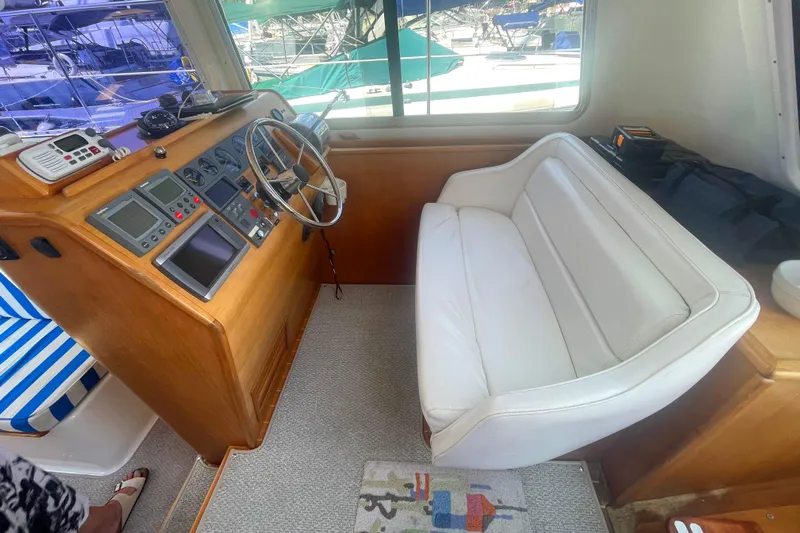 Two Buoys Yacht Photos Pics 2002 PDQ 32 Power Catamaran helm with white seating and navigation controls.
