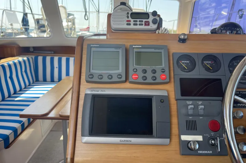 Two Buoys Yacht Photos Pics Control panel of 2002 PDQ 32 Power Catamaran with navigation and communication equipment.