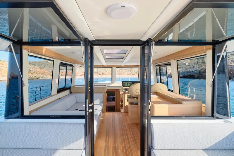  Yacht Photos Pics Interior view of 2026 Omikron Yachts OT-60, featuring modern design and spacious seating.