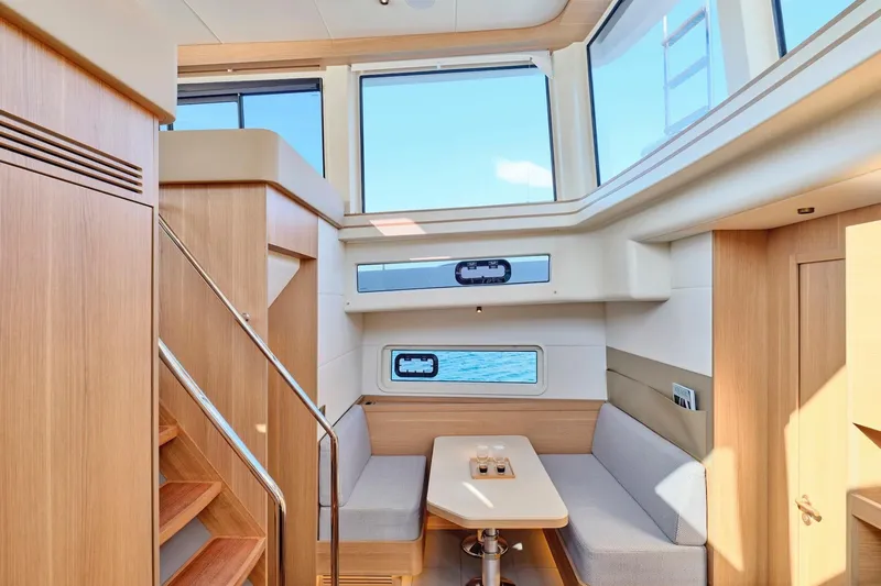  Yacht Photos Pics Luxurious interior of 2026 Omikron Yachts OT-60 with modern seating and ocean view.