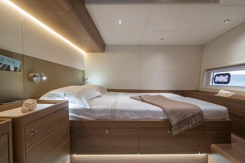  Yacht Photos Pics Luxurious cabin interior of 2026 Omikron Yachts OT-60 with modern design and cozy bedding.