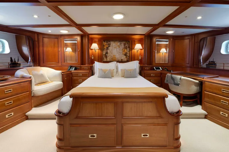 Catalina Yacht Photos Pics Luxurious wooden interior of 2001 Vitters Aft Cockpit yacht bedroom with elegant furnishings.