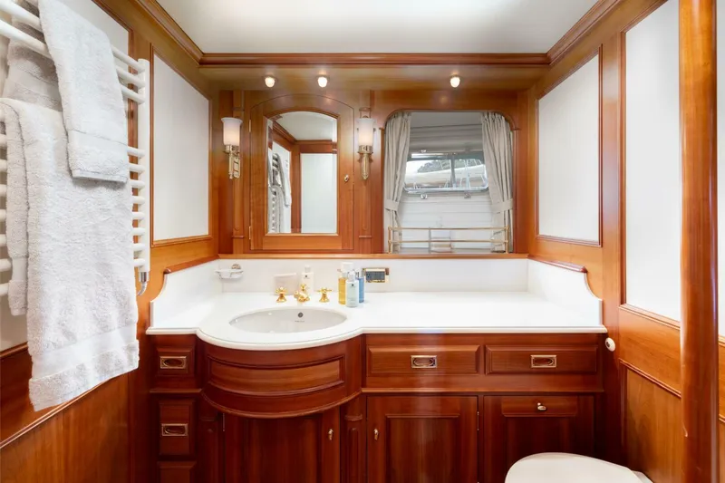 Catalina Yacht Photos Pics Luxurious wooden bathroom interior on a 2001 Vitters Aft Cockpit yacht, featuring elegant fixtures.