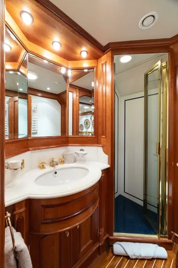 Catalina Yacht Photos Pics Luxurious yacht bathroom with wooden cabinetry, elegant lighting, and glass shower, Vitters Aft Cockpit 2001.
