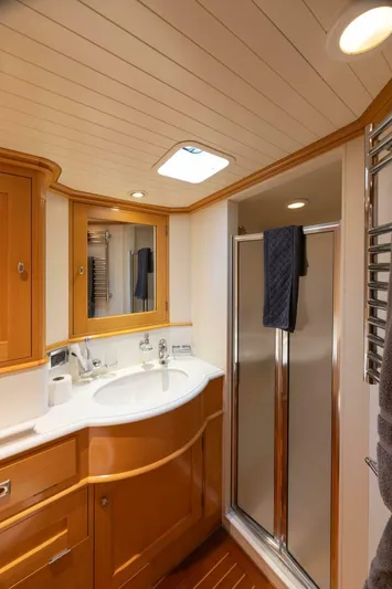 Catalina Yacht Photos Pics Luxurious bathroom in 2001 Vitters Aft Cockpit yacht with wood accents and modern fixtures.