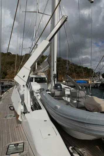 Catalina Yacht Photos Pics 2001 Vitters Aft Cockpit yacht deck with dinghy, under cloudy skies.