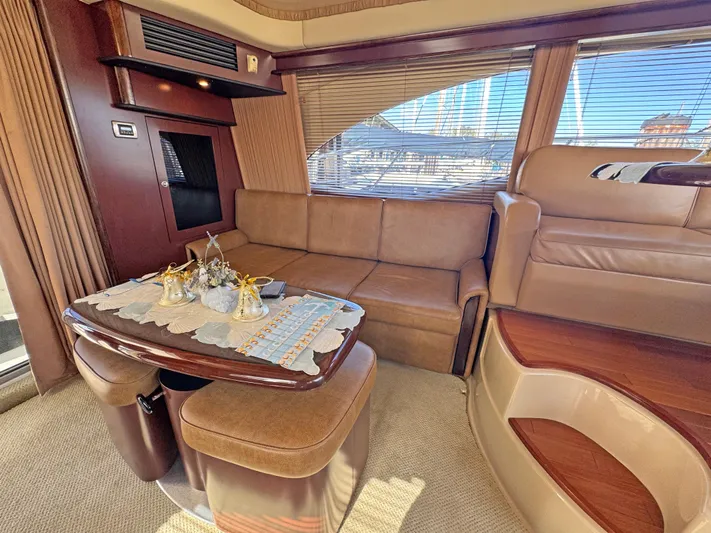 Devine Intervention Yacht Photos Pics Luxurious interior of 2007 Sea Ray 44 Sedan Bridge yacht with leather seating and elegant decor.