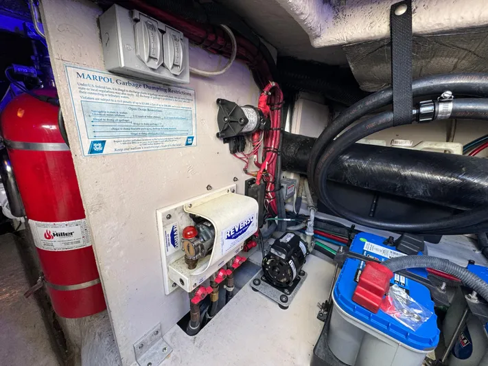 Devine Intervention Yacht Photos Pics Engine room of 2007 Sea Ray 44 Sedan Bridge with safety equipment and electrical components.