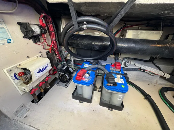 Devine Intervention Yacht Photos Pics Engine compartment of 2007 Sea Ray 44 Sedan Bridge with batteries and wiring.