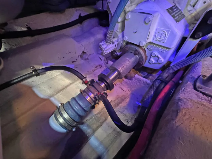 Devine Intervention Yacht Photos Pics Engine compartment of 2007 Sea Ray 44 Sedan Bridge, showing mechanical components and hoses.