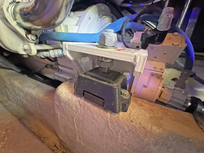 Devine Intervention Yacht Photos Pics Engine compartment of 2007 Sea Ray 44 Sedan Bridge with visible motor mount and hoses.