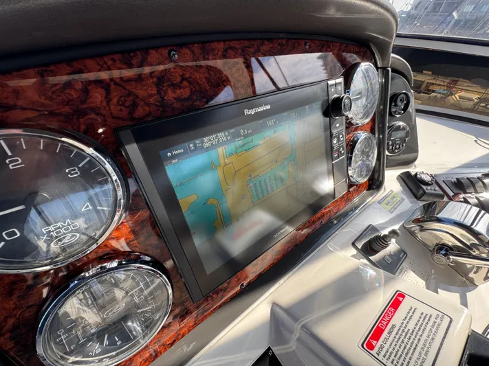 Devine Intervention Yacht Photos Pics Dashboard of 2007 Sea Ray 44 Sedan Bridge with navigation system and gauges.