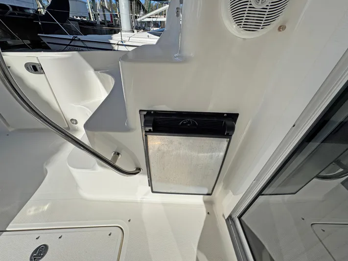 Devine Intervention Yacht Photos Pics 2007 Sea Ray 44 Sedan Bridge interior with stainless steel appliance and speaker.
