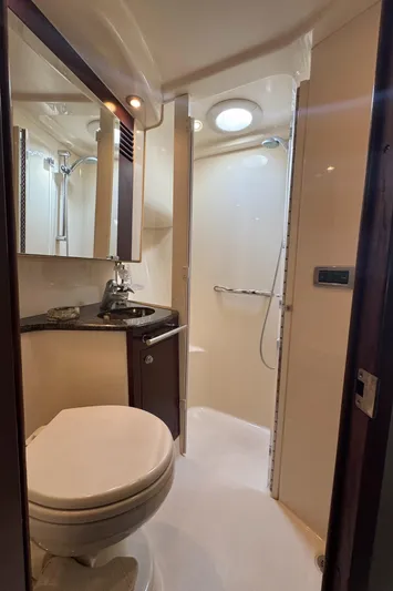 Devine Intervention Yacht Photos Pics Luxurious bathroom in 2007 Sea Ray 44 Sedan Bridge yacht with modern fixtures.