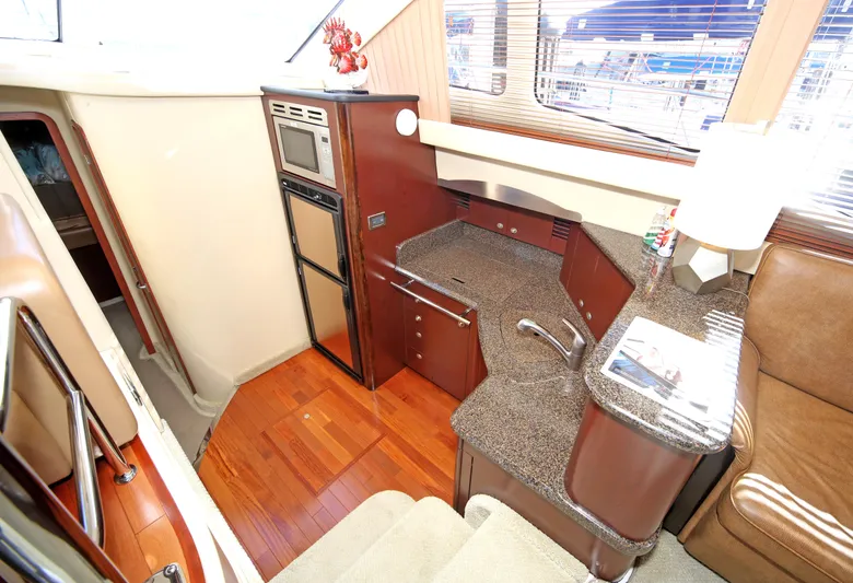 Devine Intervention Yacht Photos Pics Interior of 2007 Sea Ray 44 Sedan Bridge yacht with modern kitchen amenities.