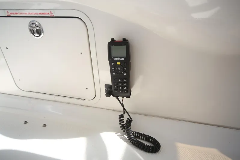 Devine Intervention Yacht Photos Pics VHF radio on 2007 Sea Ray 44 Sedan Bridge yacht interior.
