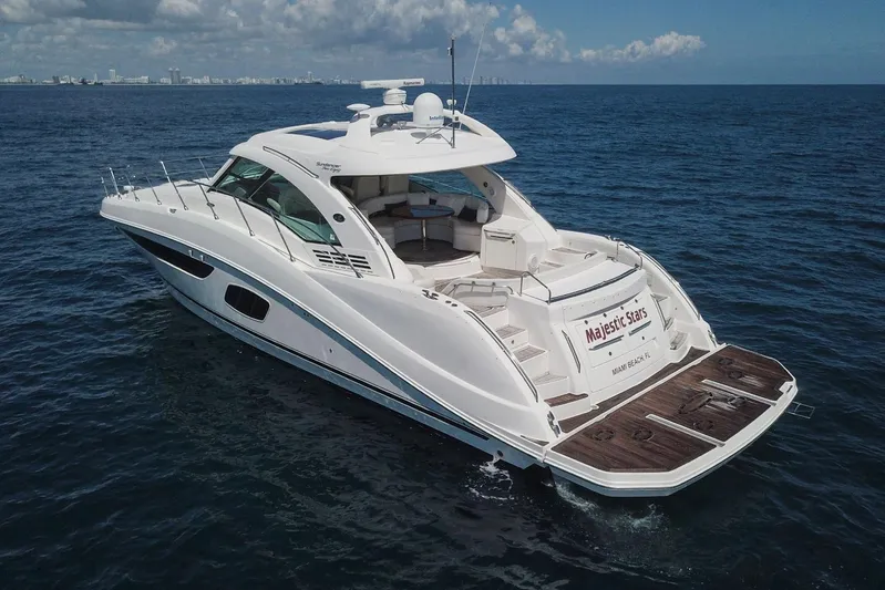  Yacht Photos Pics Luxury 2012 Sea Ray 580 Sundancer yacht cruising on open ocean waters.