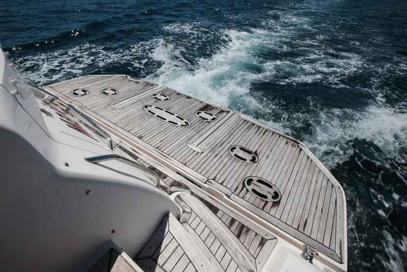  Yacht Photos Pics 2012 Sea Ray 580 Sundancer yacht with wooden deck on open water.