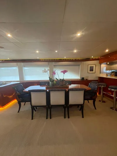 Yacht Photos Pics Luxurious dining area on 2000 Cheoy Lee CUSTOM 92 yacht with elegant seating and ambient lighting.