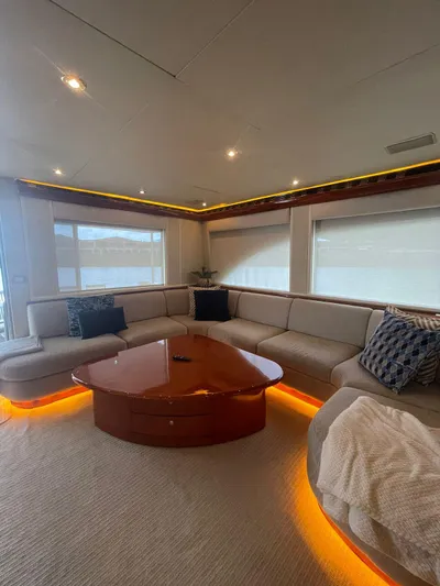  Yacht Photos Pics Luxurious interior of 2000 Cheoy Lee CUSTOM 92 yacht with elegant seating and ambient lighting.
