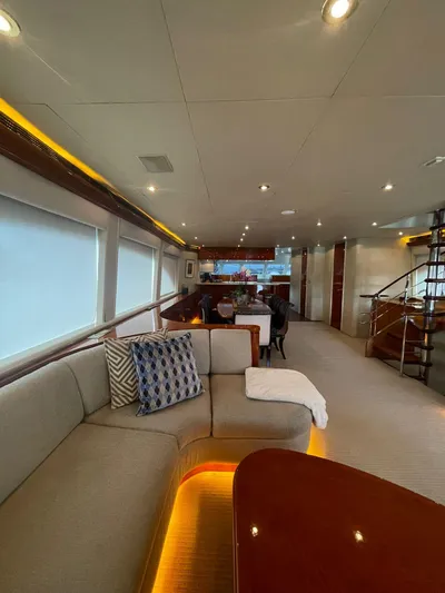  Yacht Photos Pics Luxurious interior of 2000 Cheoy Lee CUSTOM 92 yacht with modern furnishings and ambient lighting.