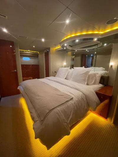  Yacht Photos Pics Luxurious bedroom on 2000 Cheoy Lee CUSTOM 92 yacht with ambient lighting and elegant decor.