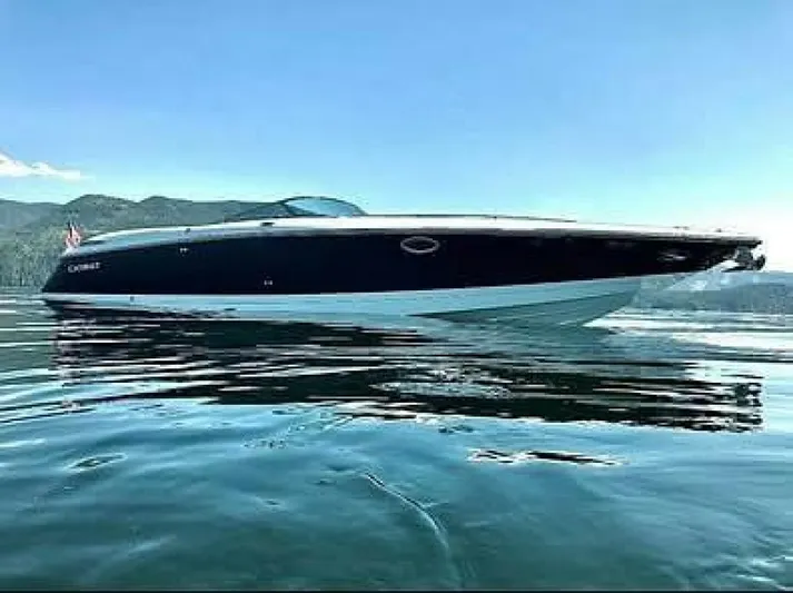  Yacht Photos Pics 2005 Cobalt 343 boat on calm water with scenic mountain backdrop.