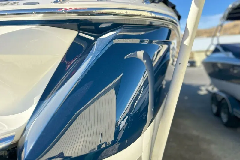  Yacht Photos Pics Close-up of a 2005 Cobalt 343 boat's sleek, reflective blue hull.