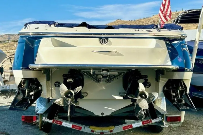 Yacht Photos Pics 2005 Cobalt 343 boat rear view with dual propellers and American flag.