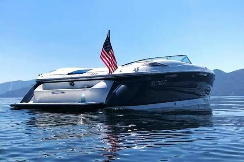  Yacht Photos Pics 2005 Cobalt 343 boat on calm water with American flag, mountains in background.