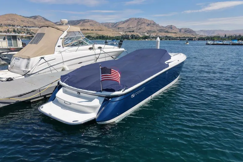  Yacht Photos Pics 2005 Cobalt 343 boat docked on a lake with scenic mountain backdrop.