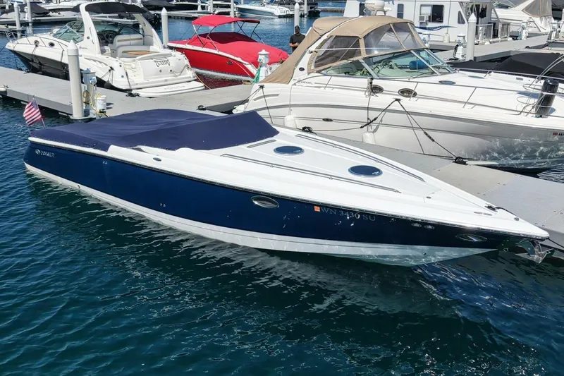  Yacht Photos Pics 2005 Cobalt 343 boat docked at marina, blue and white design, covered deck.