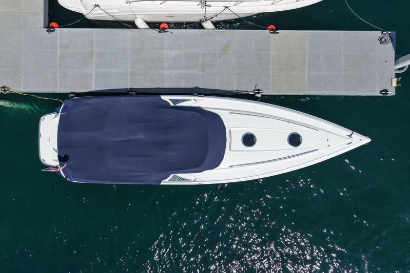  Yacht Photos Pics Aerial view of 2005 Cobalt 343 boat docked on calm water.